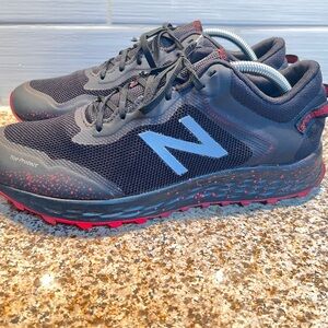New Balance Men's Black Athletic Shoes with Red Accents